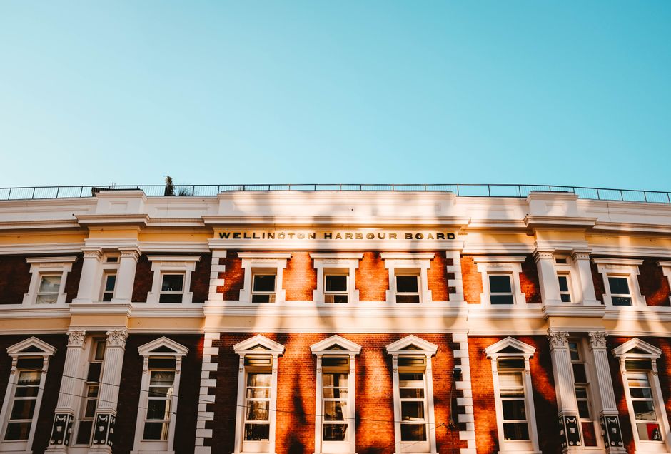 A historic government building facade in light and shadow.